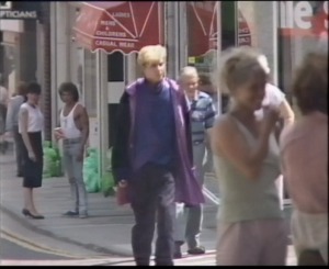 Bond wanders around the town looking for Solita's signal