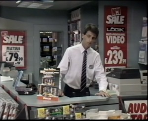 The store manager watches Bond