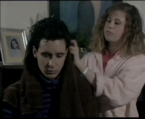 Bond has his hair coloured black by Dora