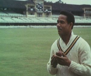 Sir Gary Sobers picks the ball up