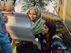 Nicky shows the Grandmother a calender