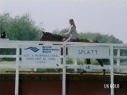 Margaret opens the locks for the boat