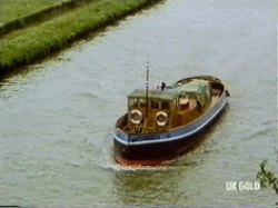 The boat continues towards the bridge - fire now out