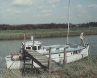 A boat is moored nearbye upstream