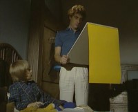 Matthew shows his latest drawing to Dad