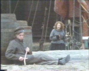 The whistling boy is watching the goings on