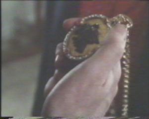 He shows the two men the watch