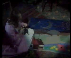 Later tha night Nia is working on her school project again when she again smells roses