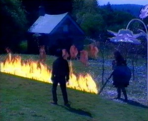 The fire wall blocks Emlyn and the pale children