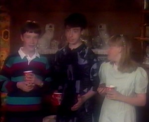 The three children wonder what Nain is planning