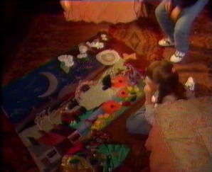 Nia goes back to work on her school project