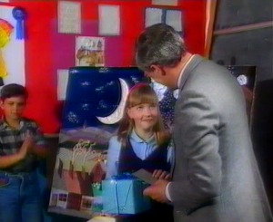 Nia goes up to receive her award