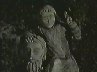 Outside she sees a stone statue