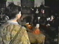 Back in the house the children are waiting for him