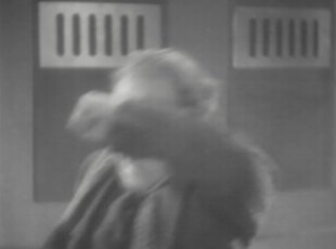 The Doctor throws himself off the lighthouse and onto the rocks and sea below