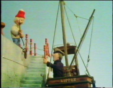 The Kipper along side the ligthhouse