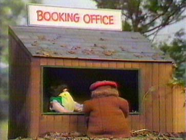 Norman buying a ticket