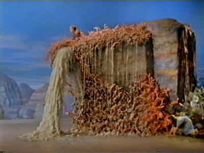 The dwarf casts a spell to freeze the waters